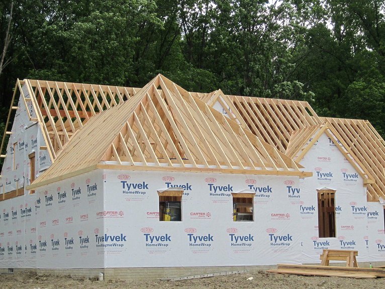 New home under construction, roof framed and dried in