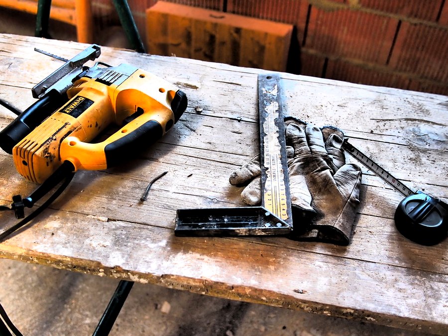 Roofing tools laid out on a workbench